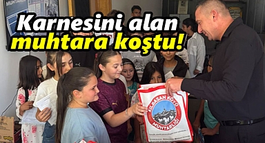 Karaman'da karnesini alan çocuklar muhtara koştu